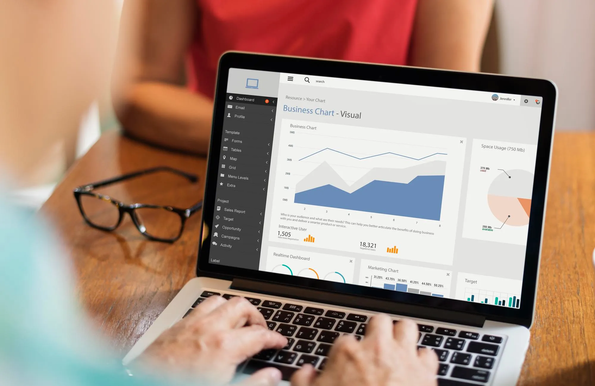 Person holding smartphone with charts and graphs on screen